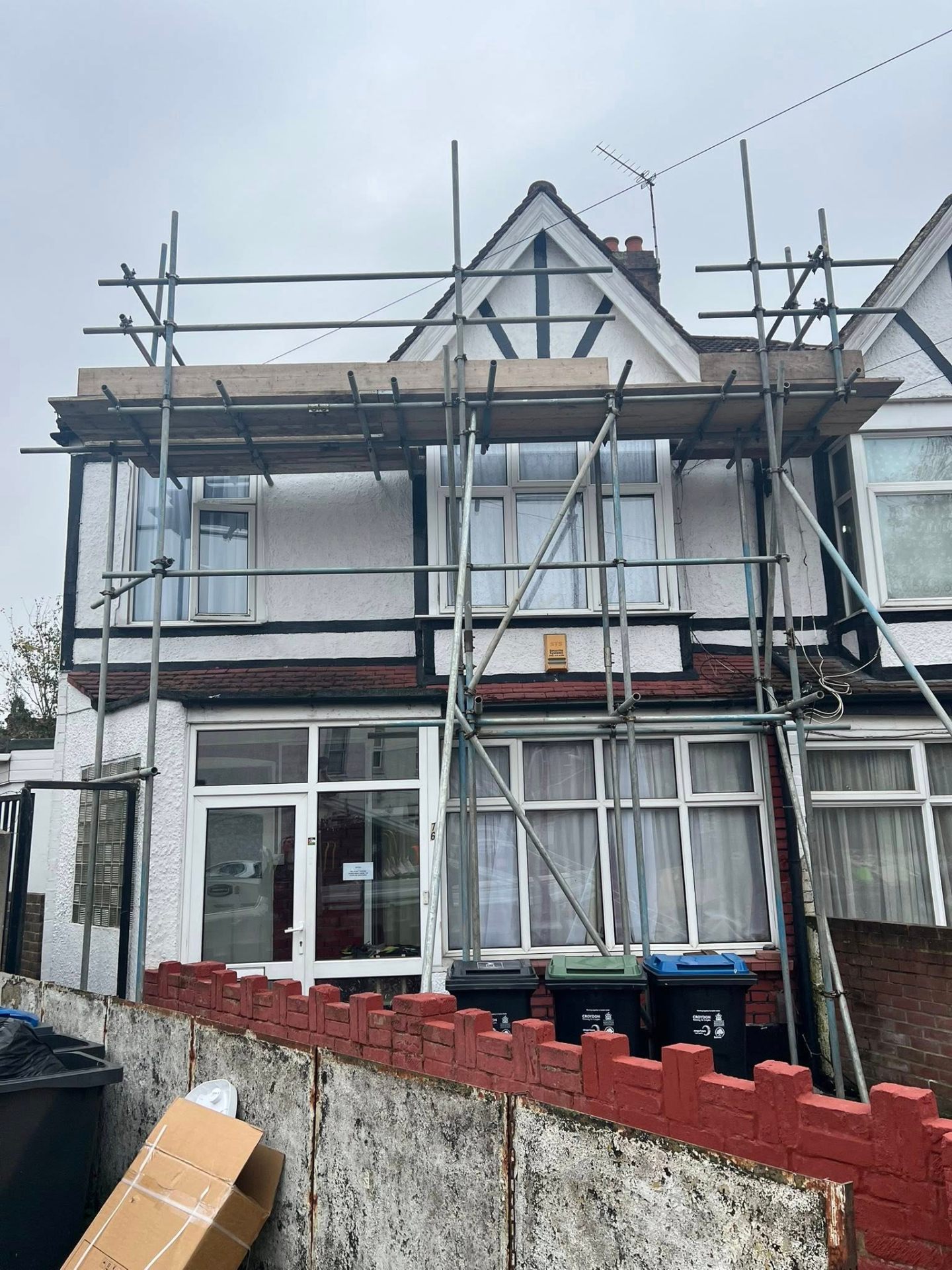 Full-front scaffold on a mock-Tudor semi